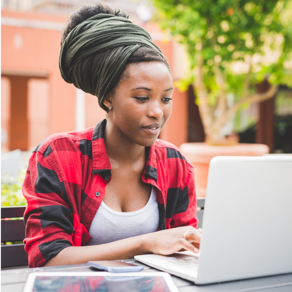 Someone typing on their laptop, representing the process of creating a personal book and the power of storytelling